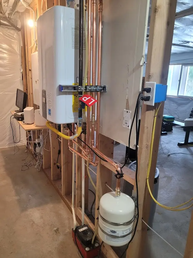 Licensed plumber repairing a kitchen sink in Tomah