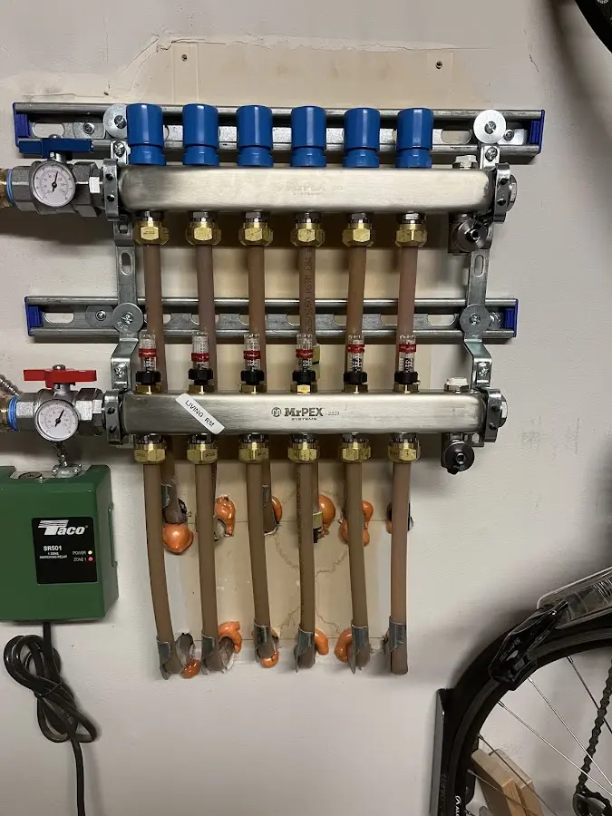 Plumber performing Water Heater Repair at a residential property in Tomah